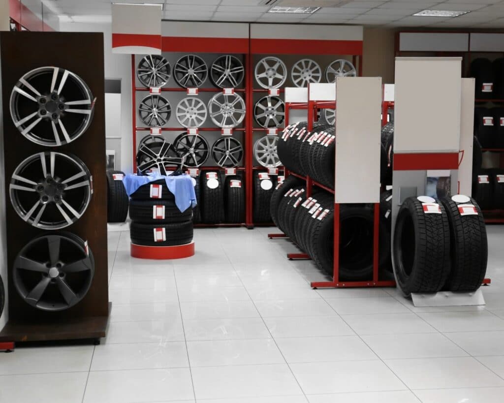 Automotive shop with tire rims and tires on display