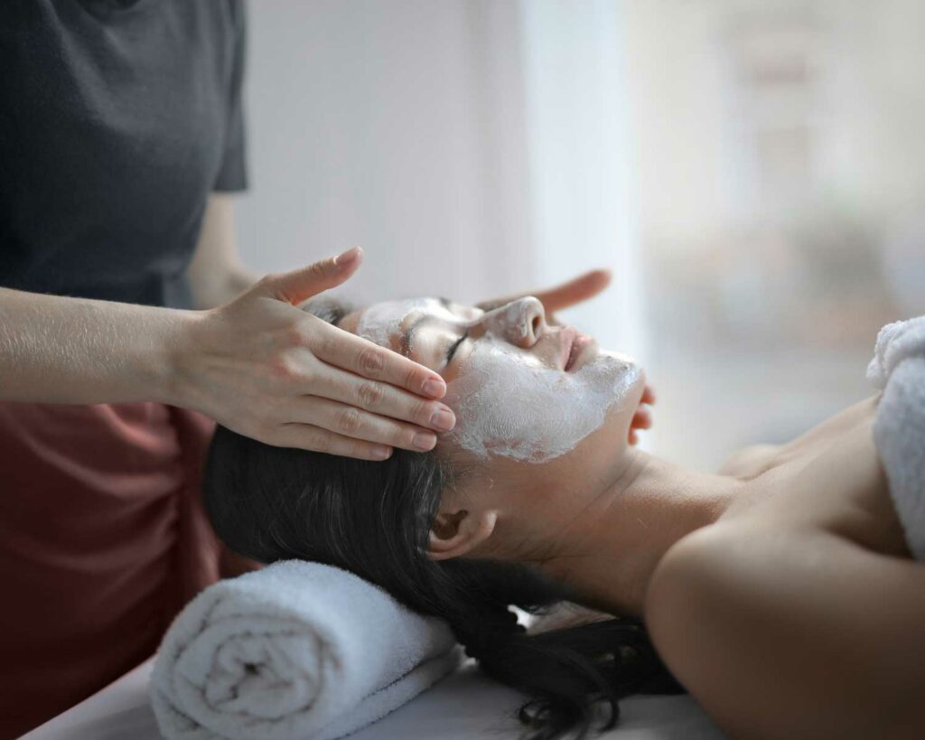 Woman laying down getting a facial